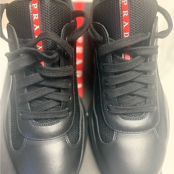 Prada Nero Sneakers with Red Stripe